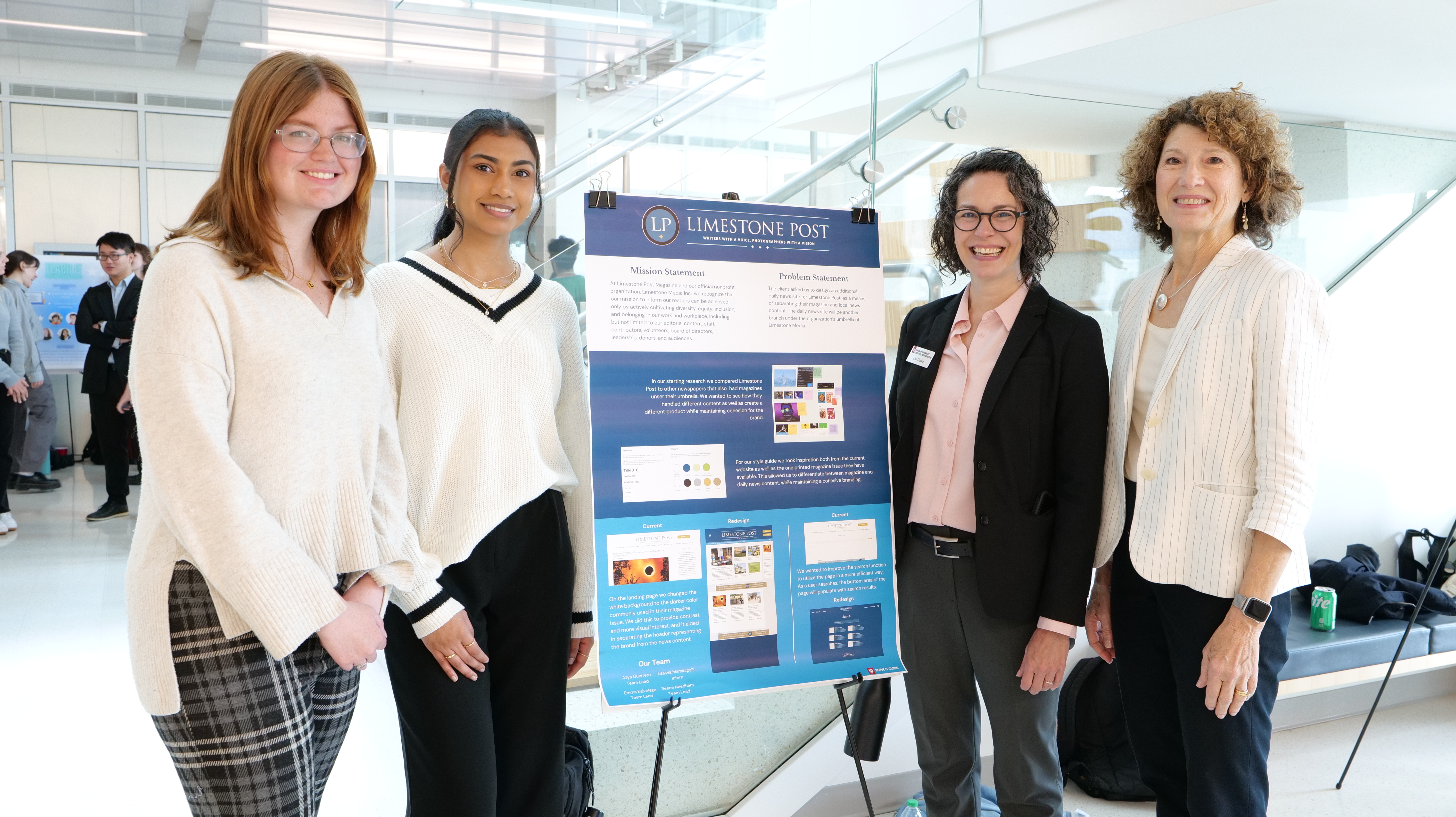 alt="students standing with end of semester poster, director, and clinic president"